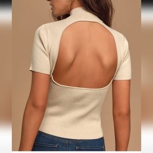 Ribbed/Turtle neck backless crop top is size small. Color beige